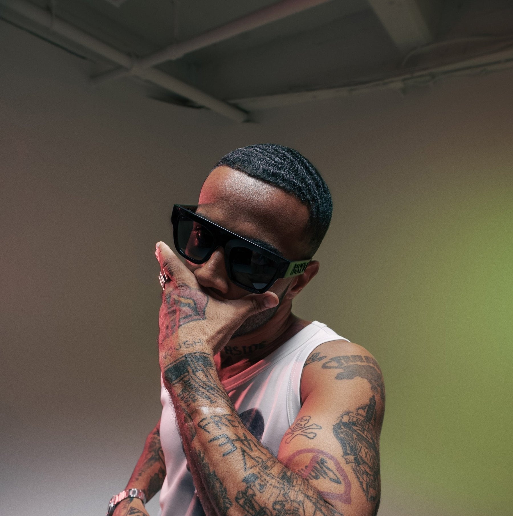 Vic Mensa posing on white cyc with black fabric. Shot by Colt Grice in Blackout Studio B at Apex Photo Studios