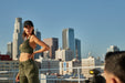 Model on Apex Photo Studios rooftop in downtown los angeles with skyscrapers in the back ground