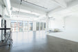 Daylight Photo Studio with floor to ceiling windows in downtown los angeles. Available to rent through Apex Photo Studios. 