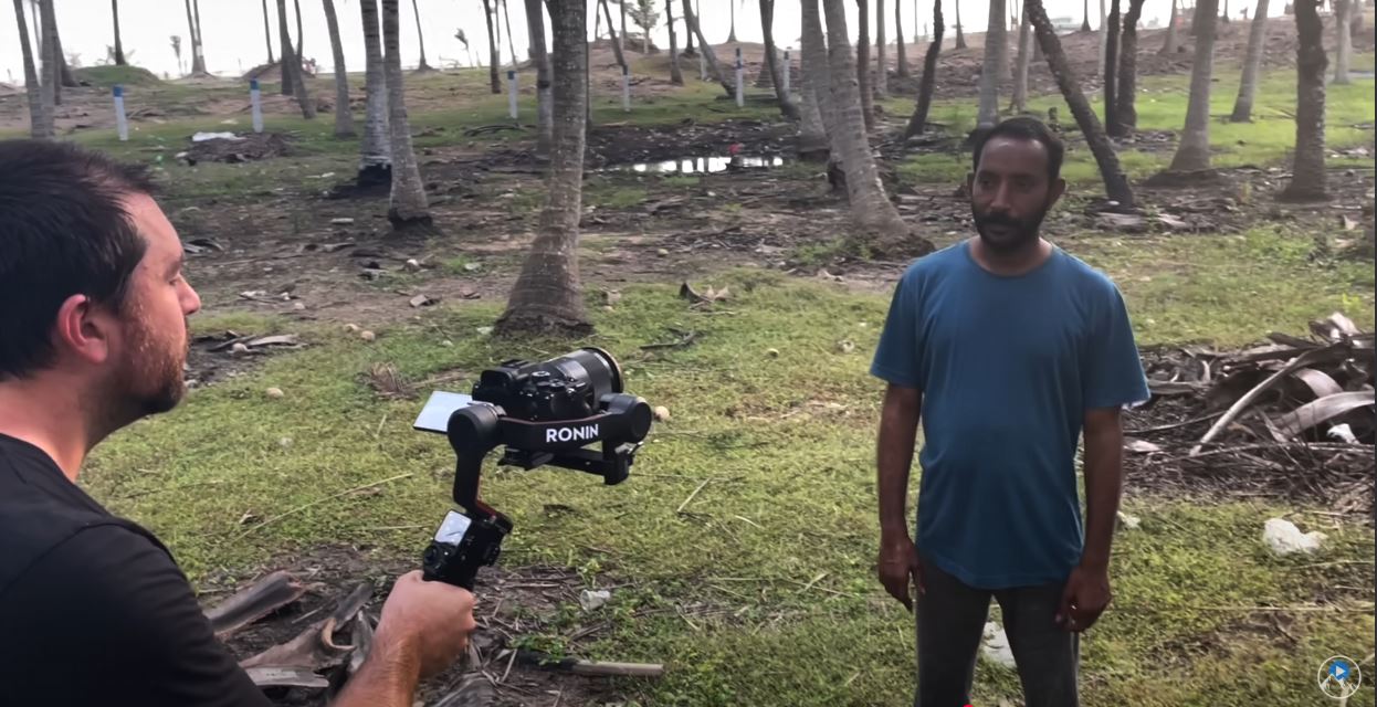 Jeven Dovey filming a man in India